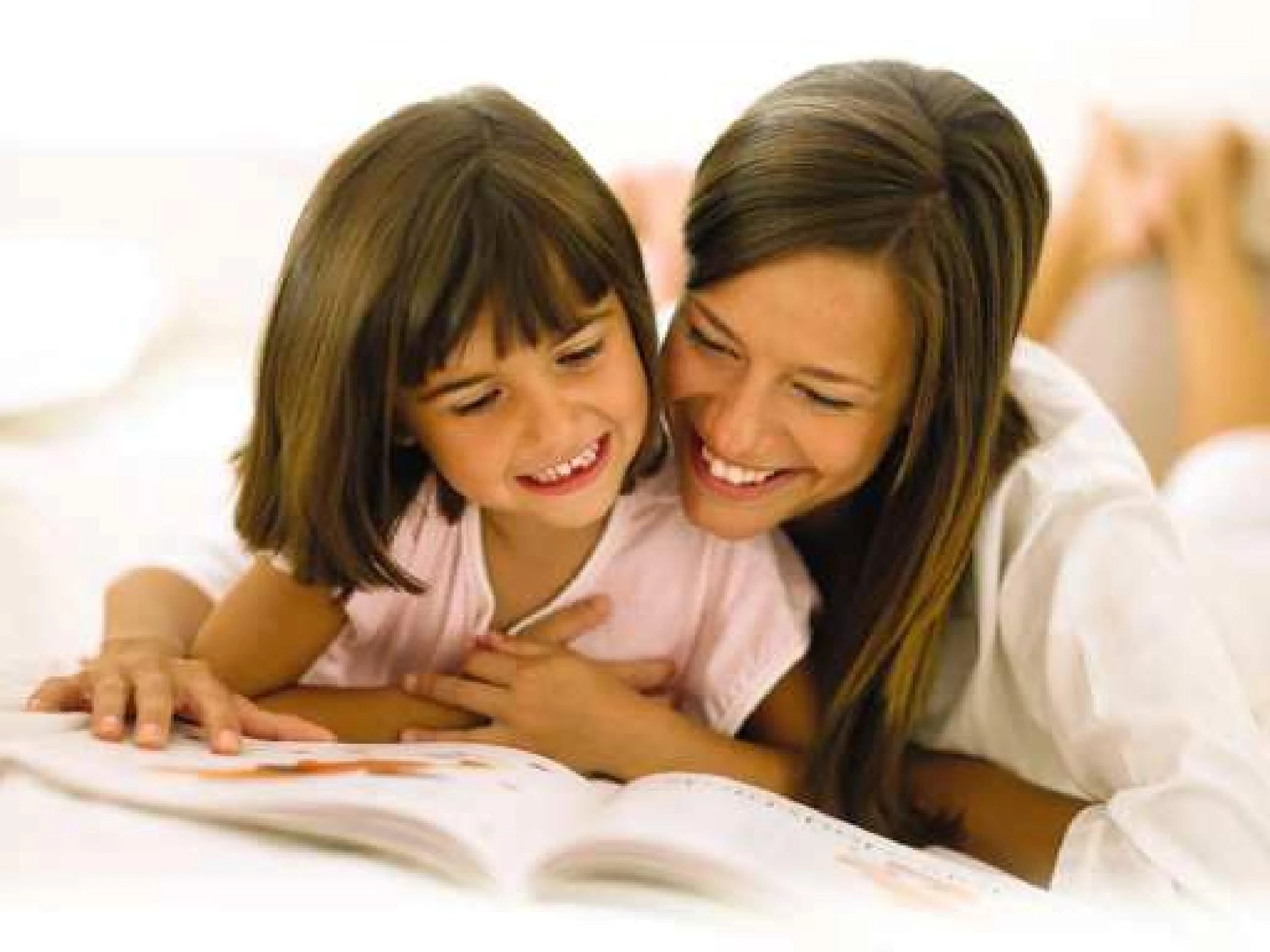 Family time, mom and daughter are reading together