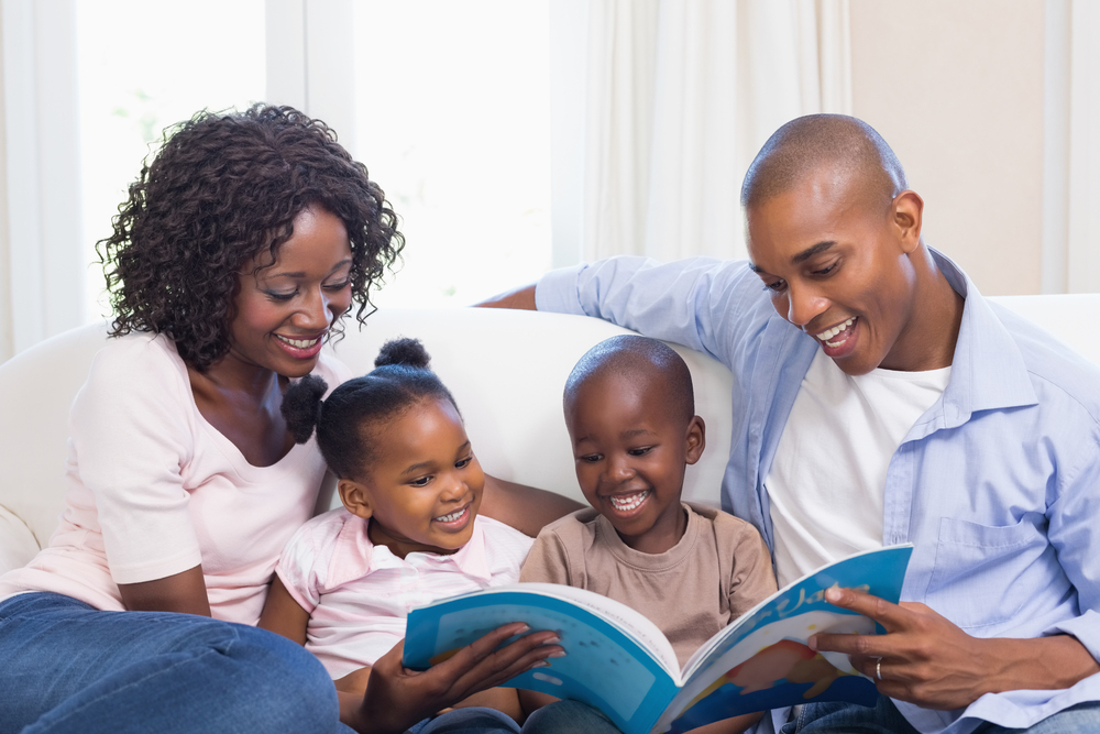 Parents and kids reading a book